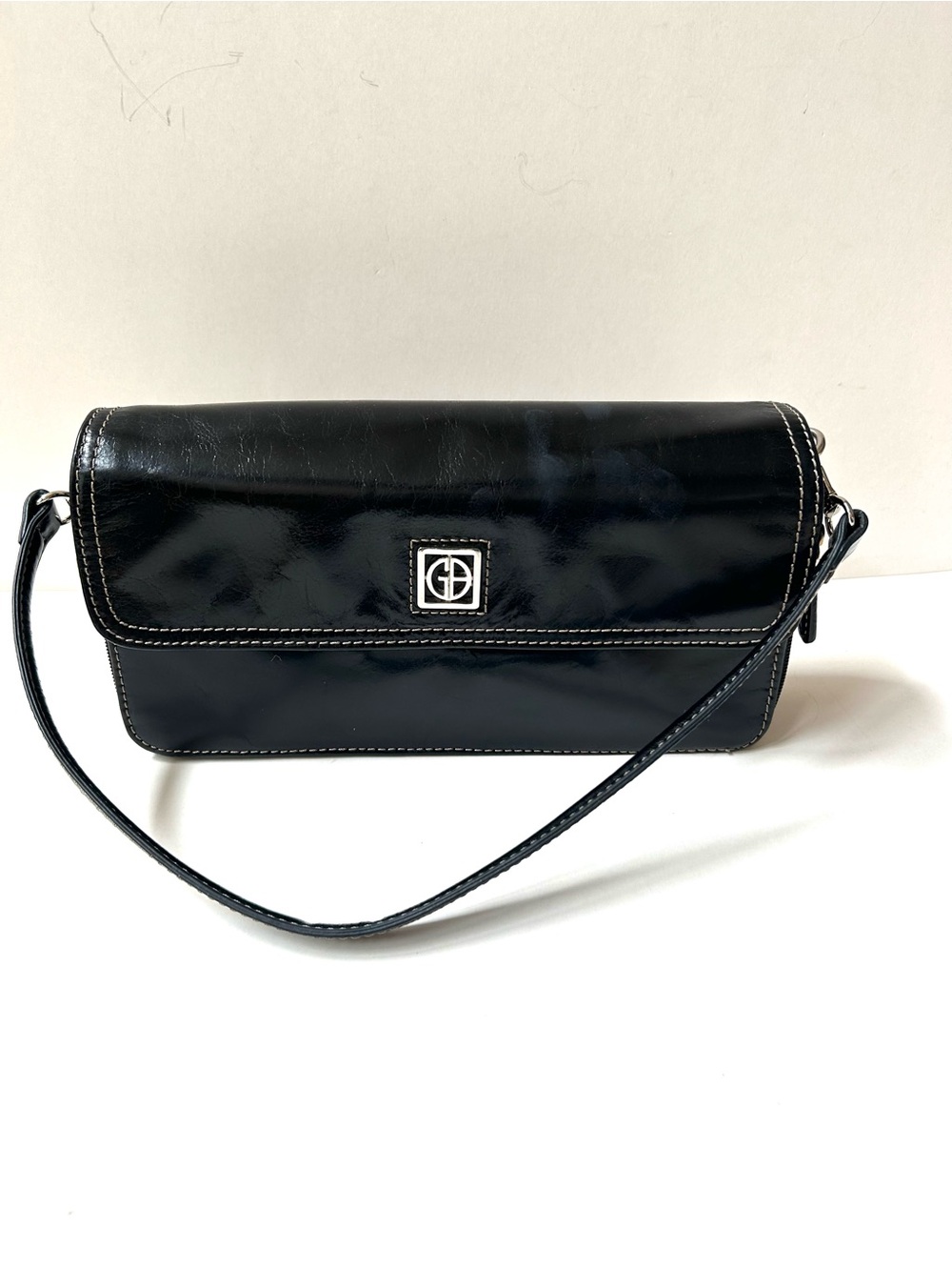 Giani Bernini Smooth Leather Wristlet/Shoulder Bag with Silver Logo Accent.